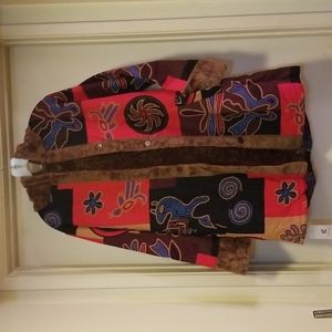Soft brown teddy fur lined coat, and hood. Bright colored outside design.